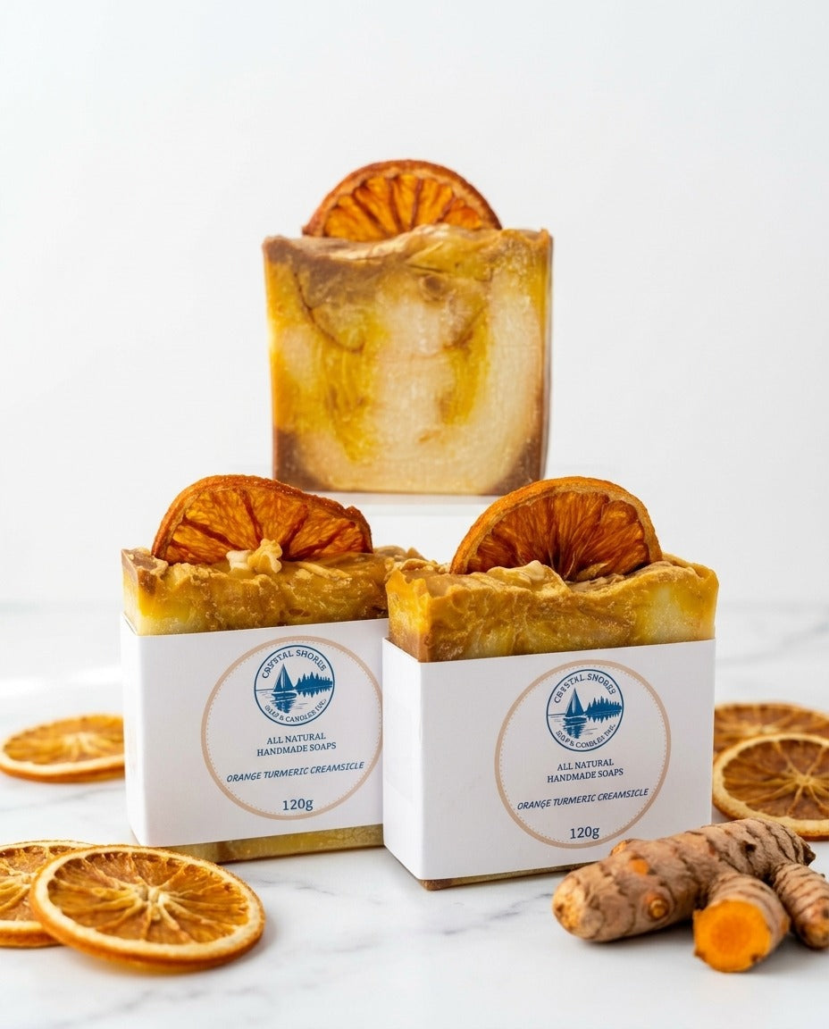 Orange Turmeric Creamsicle — handmade soap on marble with dried orange and turmeric