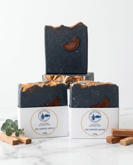 The Copper Moon — handmade charcoal soap on marble with cedar wood